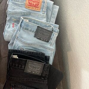 Levi’s boys size 14 reg jeans. Two light wash denim and one black pair.